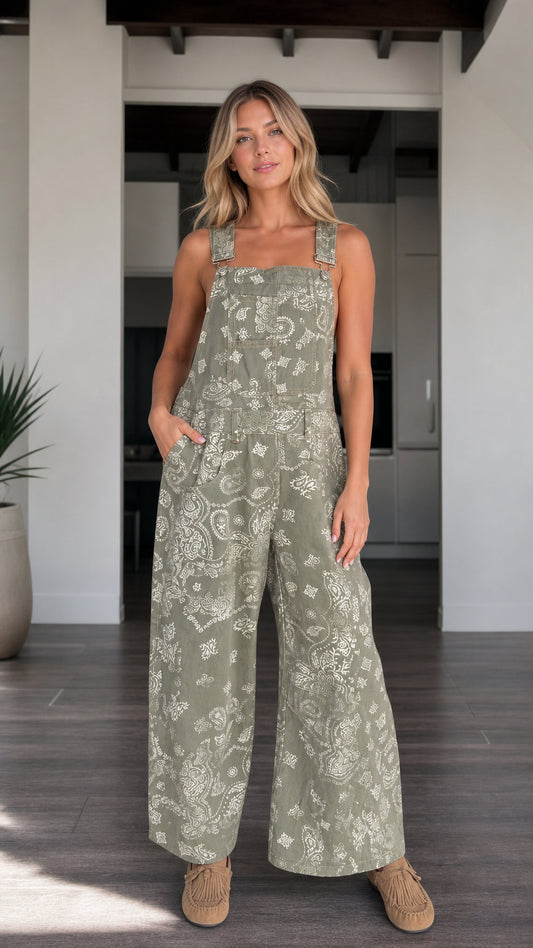 Front view of woman wearing Sage Green paisley print wide-leg bib overalls