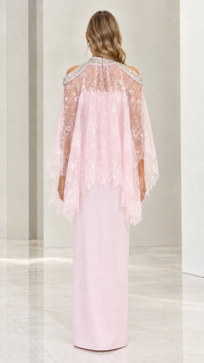Back view of blush pink maxi dress showing lace capelet drape and back slit
