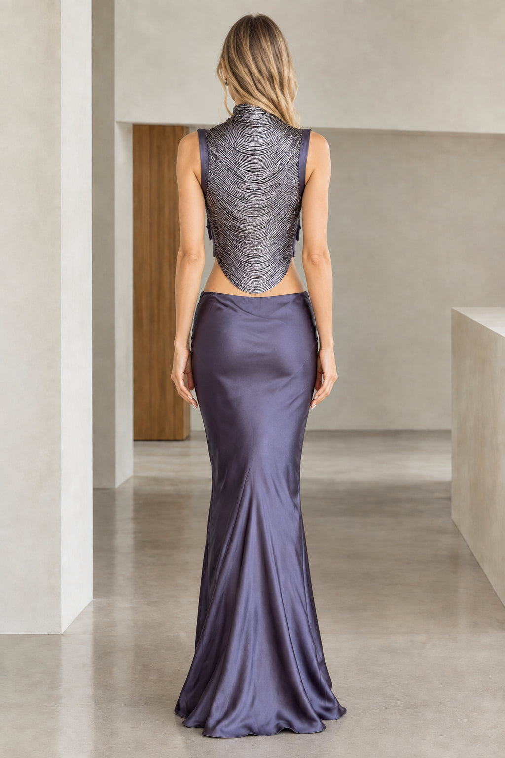 Back view of Slate Blue two-piece formal dress showing open back cutout and floor-length satin drape