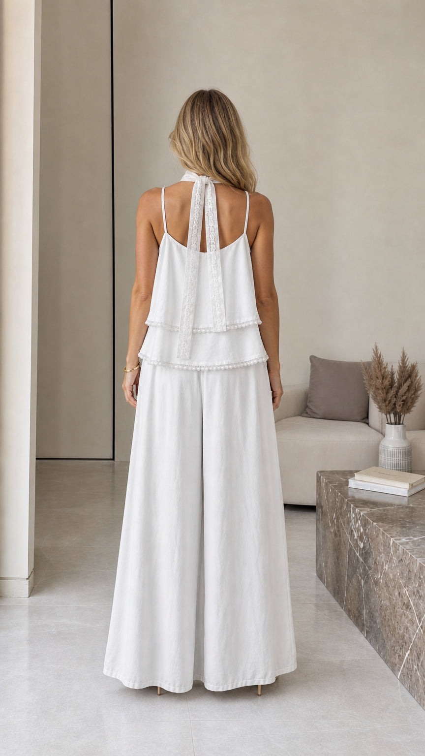 Back view of model showcasing scarf detail on white cami set