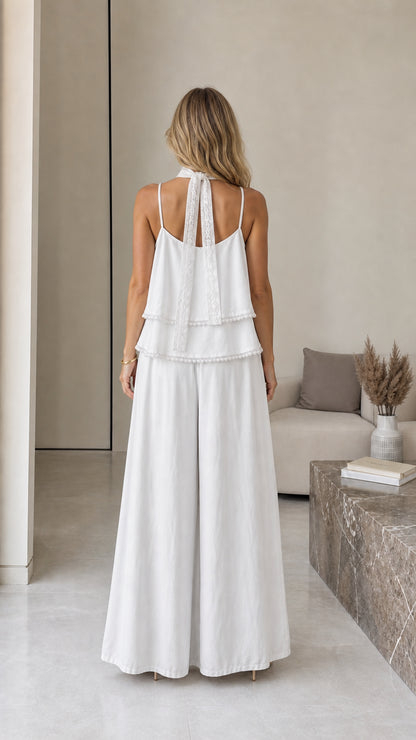 Back view of model showcasing scarf detail on white cami set