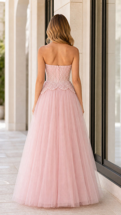 Back view of blush pink strapless tulle evening gown