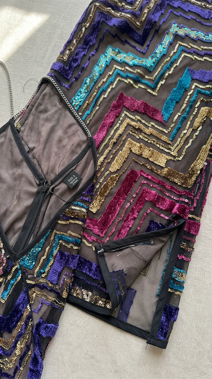 Close-up detail of interior lining, concealed zipper, and sequin mesh construction