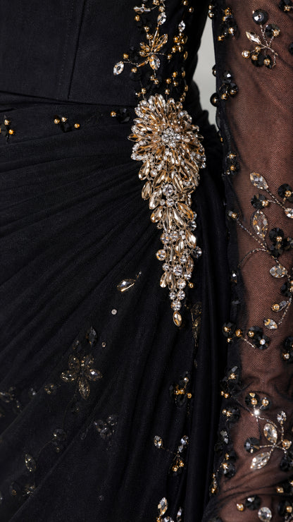 Close-up detail of rhinestone waist appliqué and crystal beadwork