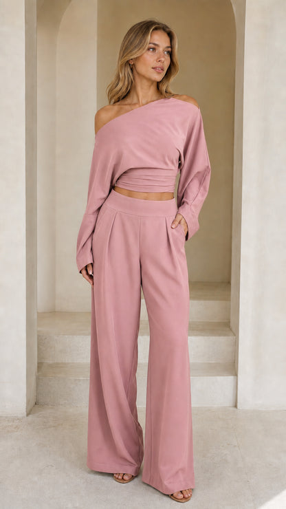 Full front view of model wearing dusty pink off-shoulder crop top and wide-leg pant set