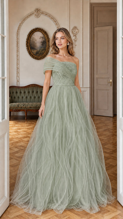 Front view of model wearing sage green sequin tulle evening gown