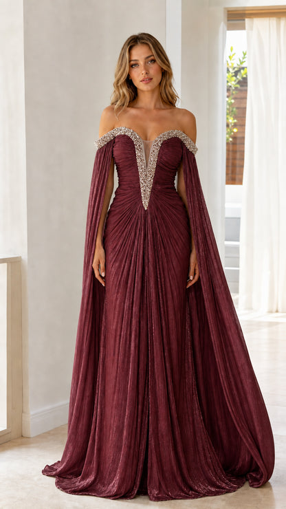 Front view of model wearing burgundy wine off-the-shoulder cape sleeve pleated evening gown
