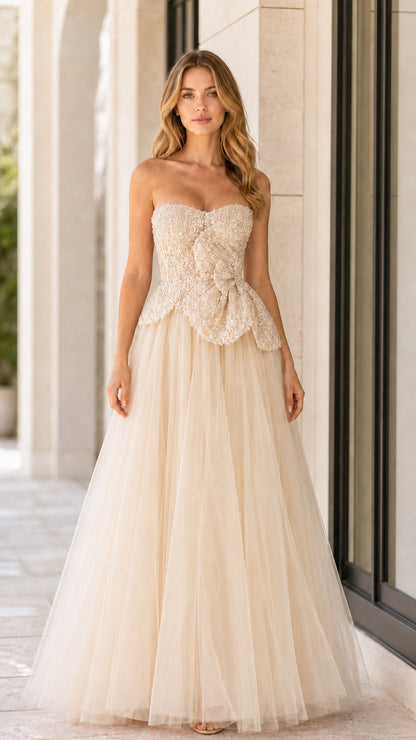 Front full-length view of champagne strapless beaded tulle ball gown